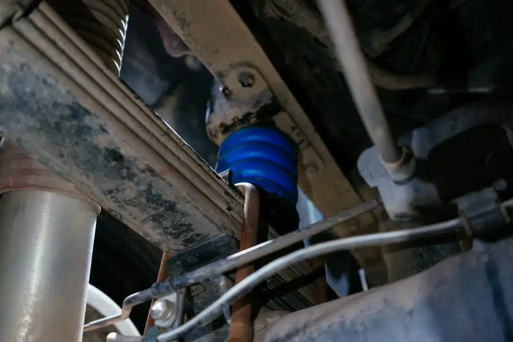 Blue SumoSpring installed on a Toyota Tacoma for Airbags vs bump stops vs SumoSprings