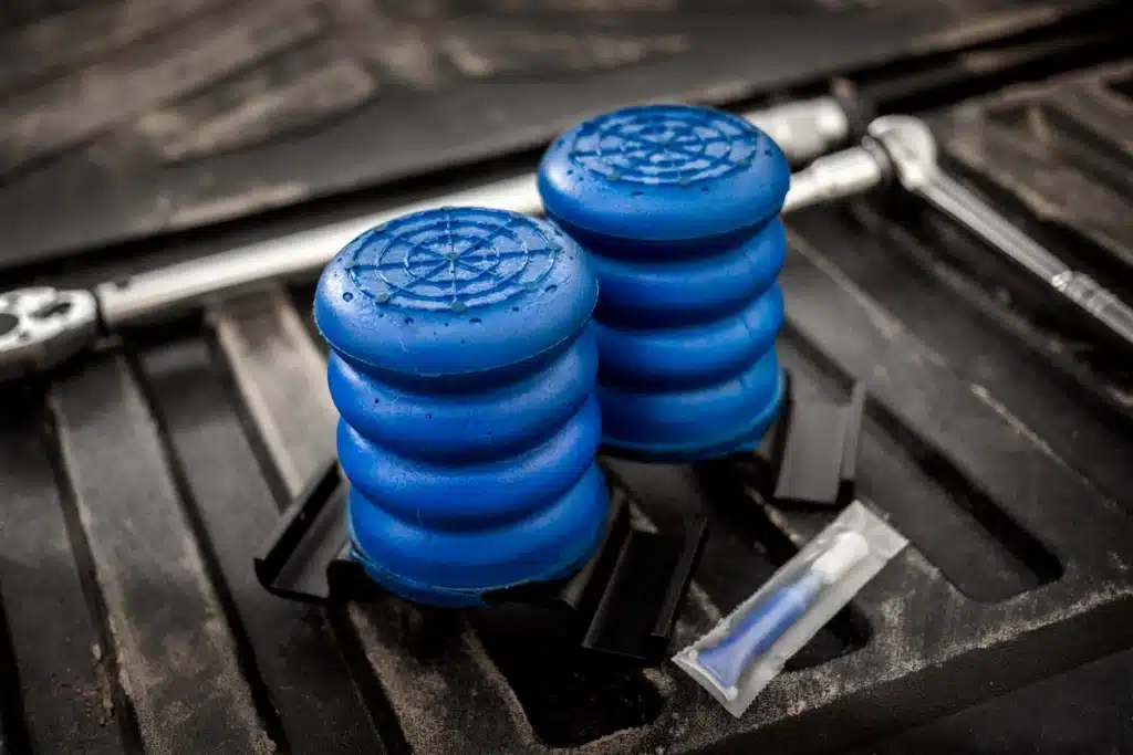Blue SumoSprings on the bed of a toyota with thread locker