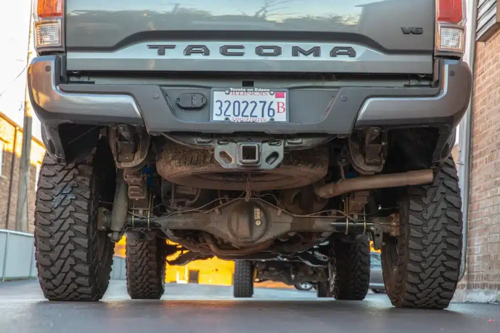 Rear end of Toyota Tacoma showing the u-bolts of the install