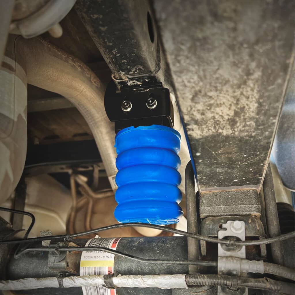 A Blue SumoSpring Installed on a vehicle
